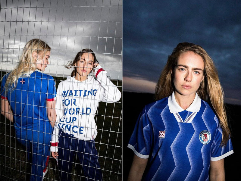 Two women wearing sports jerseys with a dark sky background